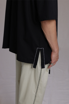 ALBI Sapan Shirt, an oversized short sleeve cotton jersey tee with hand-stitched side slits