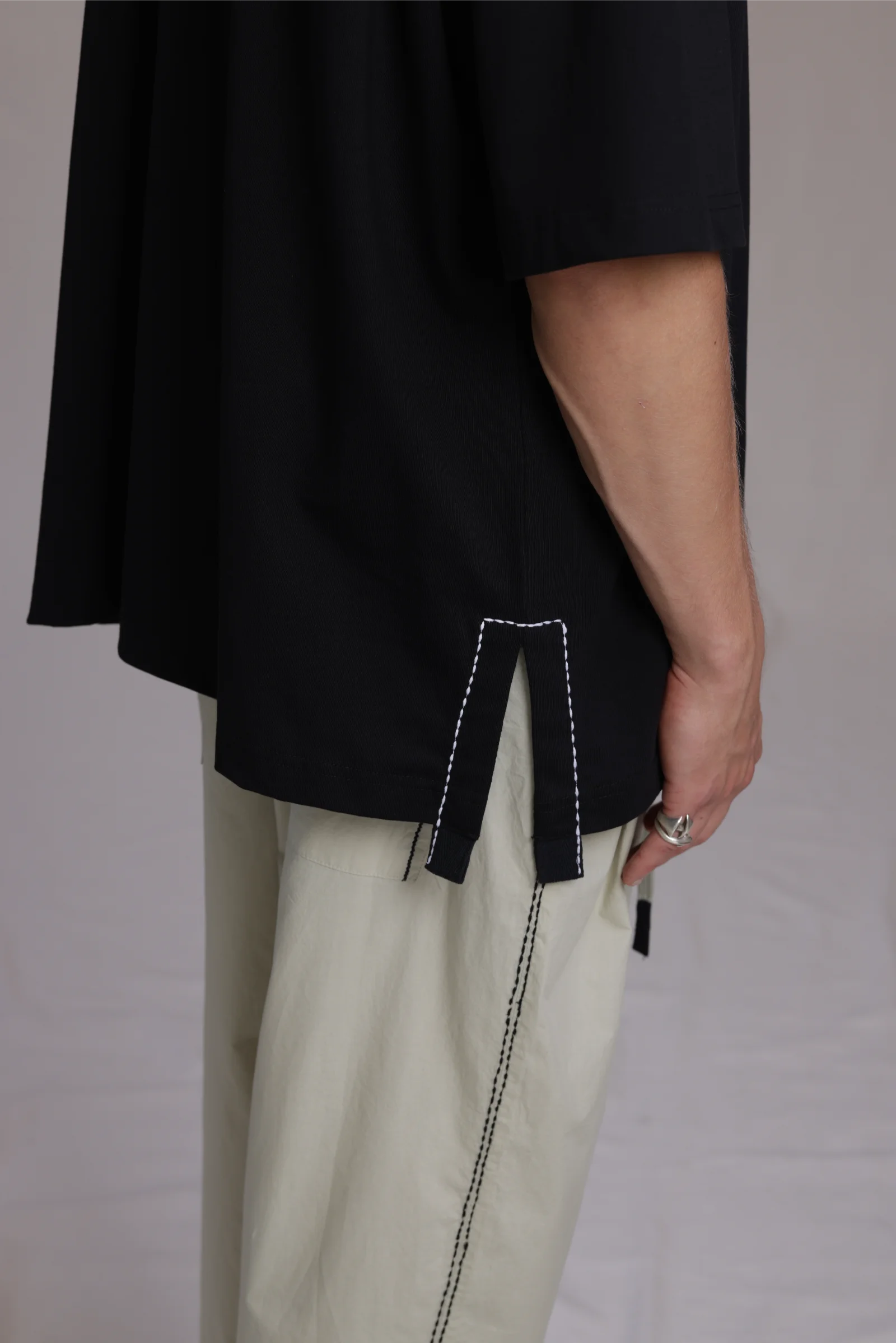 ALBI Sapan Shirt, an oversized short sleeve cotton jersey tee with hand-stitched side slits
