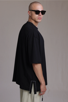ALBI Sapan Shirt, an oversized short sleeve cotton jersey tee with hand-stitched side slits