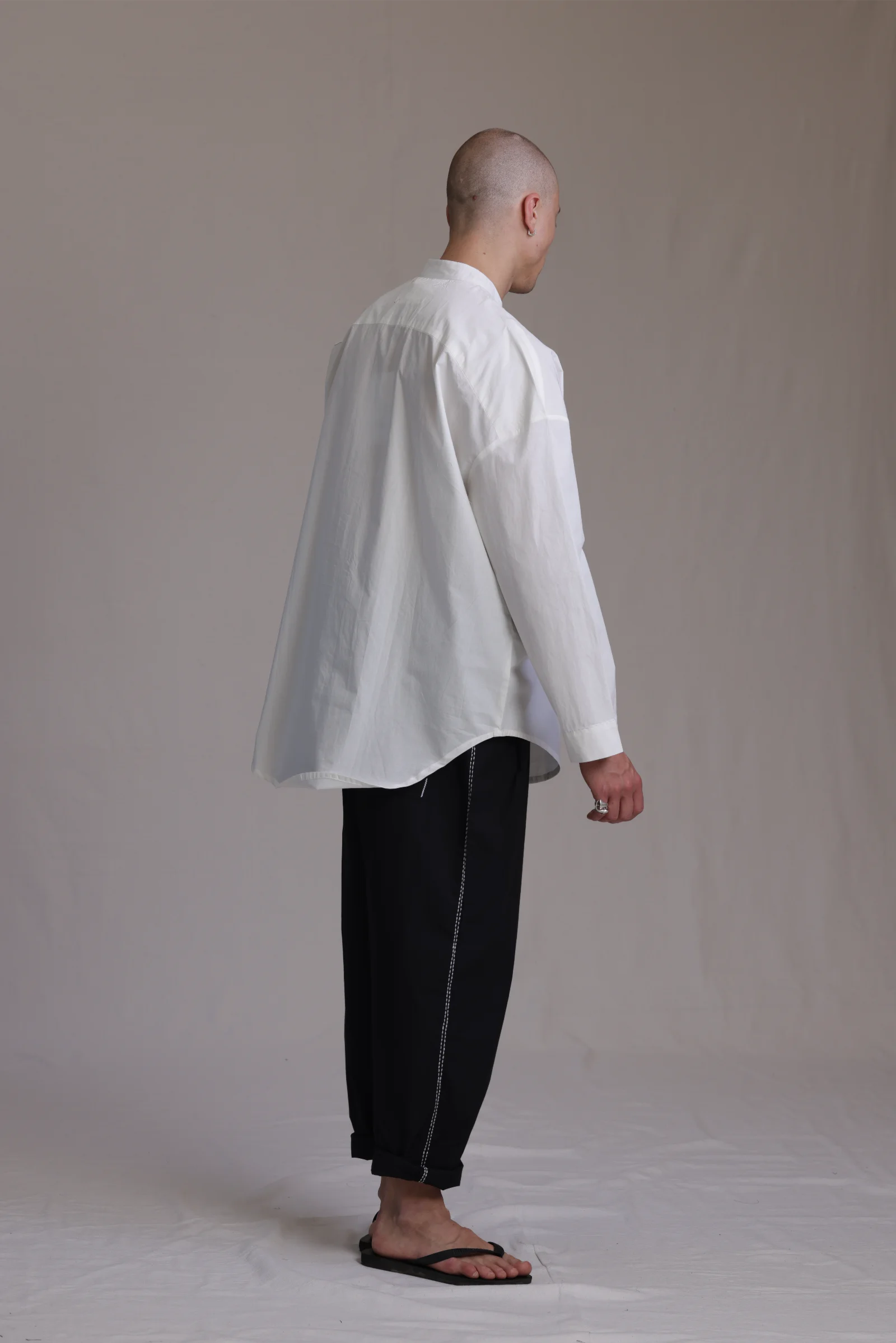 ALBI Rin Shirt, an oversized cotton poplin band collar shirt with tonal hand-stitched detailing