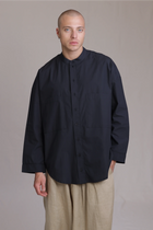 ALBI Rin Shirt, an oversized cotton poplin band collar shirt with tonal hand-stitched detailing