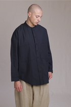 ALBI Rin Shirt, an oversized cotton poplin band collar shirt with tonal hand-stitched detailing