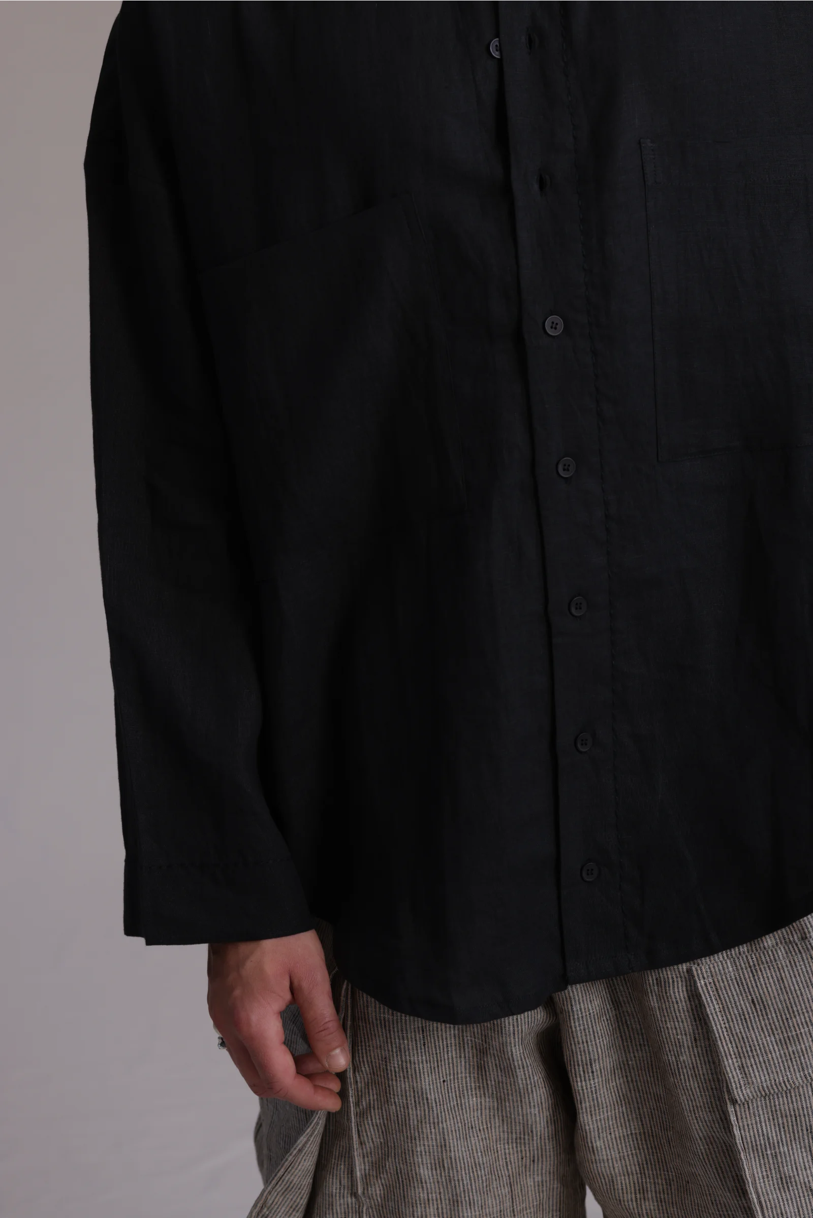 ALBI Hikari Shirt, an oversized linen band collar shirt with tonal hand-stitched detailing