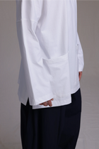 ALBI Tsuki Shirt, an oversized long sleeve cotton jersey tee with patch pockets and side slits