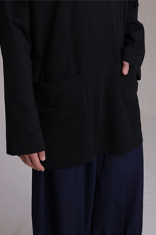 ALBI Tsuki Shirt, an oversized long sleeve cotton jersey tee with patch pockets and side slits