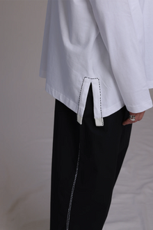 ALBI Michi Shirt, an oversized long sleeve cotton jersey tee with hand-stitched side slits