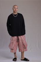 ALBI Michi Shirt, an oversized long sleeve cotton jersey tee with hand-stitched side slits