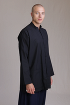 ALBI Sei Shirt, a long oversized cotton poplin band collar shirt with low patch pockets