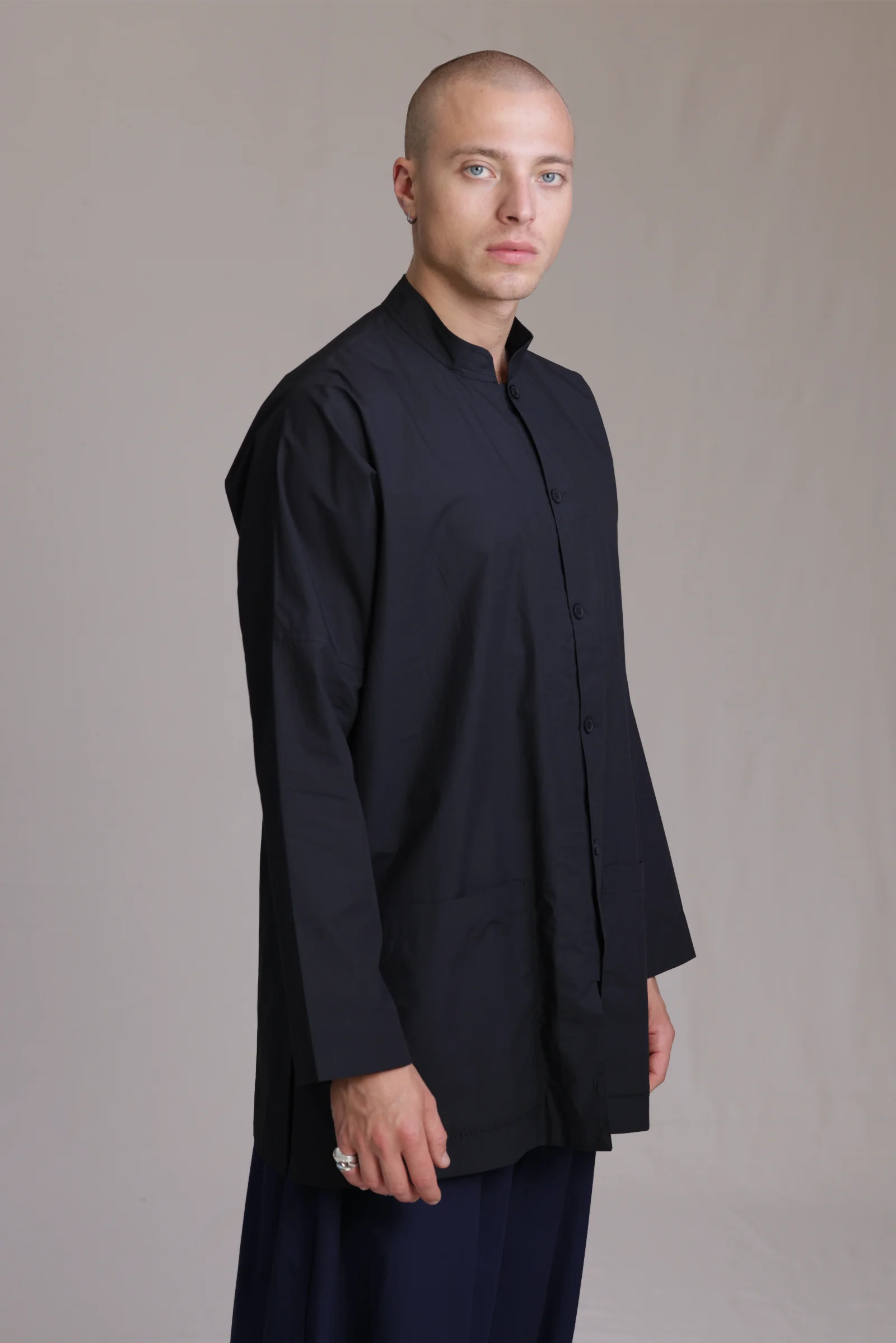 ALBI Sei Shirt, a long oversized cotton poplin band collar shirt with low patch pockets