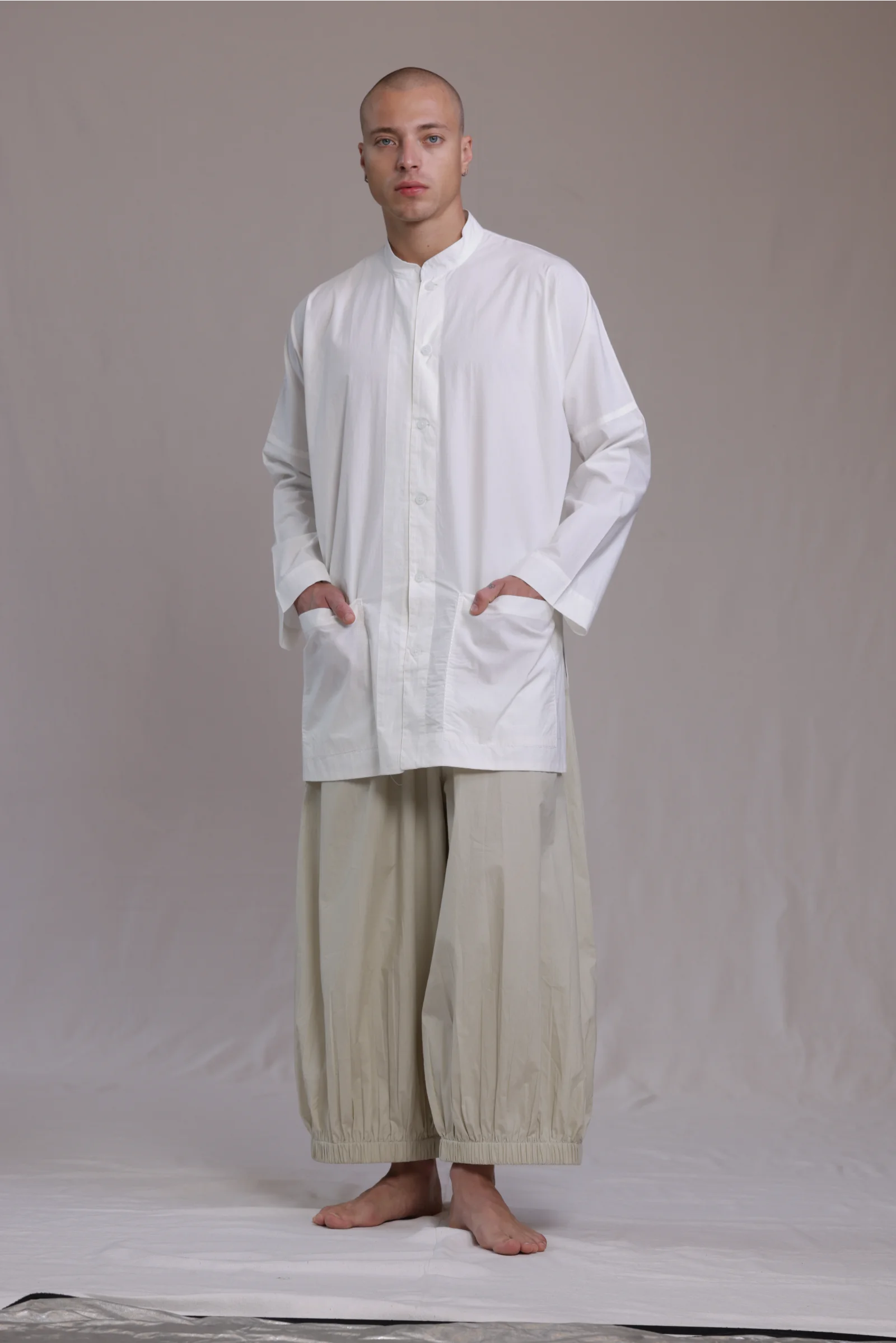 ALBI Sei Shirt, a long oversized cotton poplin band collar shirt with low patch pockets