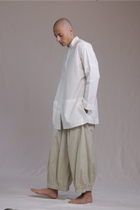 ALBI Sei Shirt, a long oversized cotton poplin band collar shirt with low patch pockets